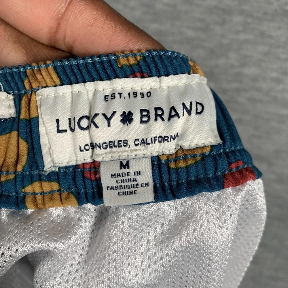Lucky Brand Swim Shorts Mens Medium Blue Tropical Dot Print Lined Trunks Stretch